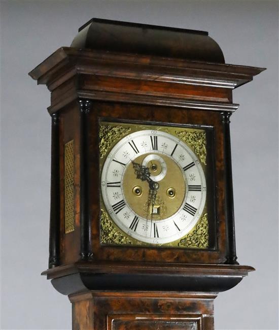 Sam Macham of London. A William and Mary mulberry cased eight-day longcase clock, 7ft. 2in. (plinth altered, parts replaced)